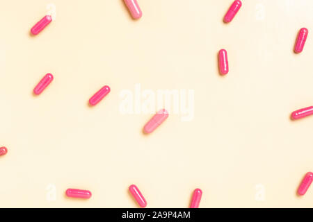 Colorful medicine pills capsules on a single color background Stock Photo