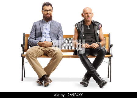 Full length portrait of a smiling bearded man and a grumpy punker sitting on a bench isolated on white background Stock Photo
