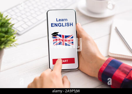 Language Educational App Opened On Smartphone In Man's Hands Stock Photo