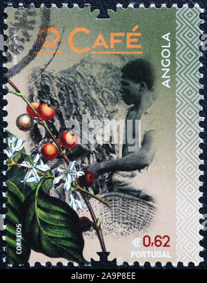 Coffee production of Angola celebrated on postage stamp Stock Photo