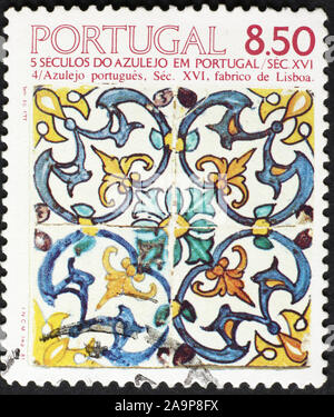 Traditional handpainted tiles on portuguese postage stamp Stock Photo