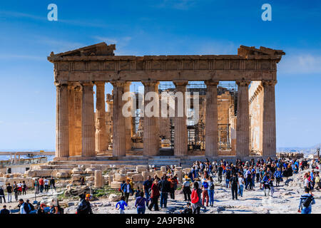 Athens, Greece - November 3, 2018: Tourists at the famous Acropolis Hill enjoying Parthenon monument in Athens, Greece. Stock Photo