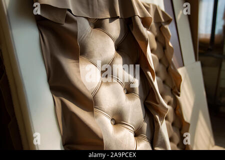 Carriage screed sofa. Production of expensive furniture. Stock Photo