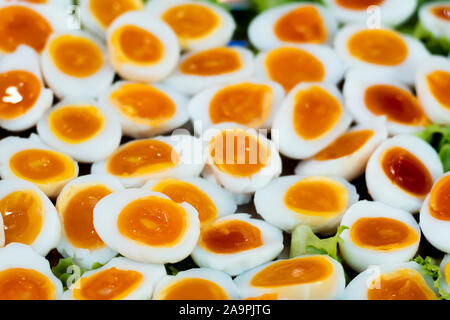 boiled egg. medium-boiled egg. half-boiled egg. boiled egg on white dish. cooked egg. sliced in halves . health and food background Stock Photo