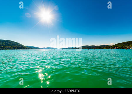 Lakeside Holidays. Great lake Klagenfurt am Worthersee. The large lake of Klagenfurt in Austria. Many boats are anchored. Summer holiday resort of Stock Photo