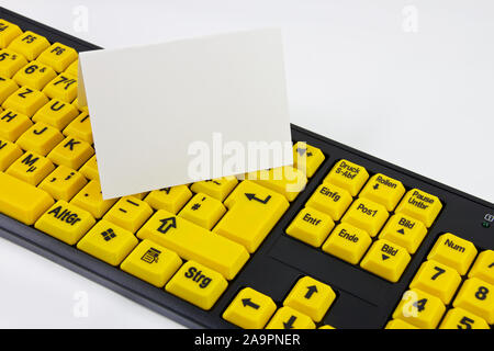 Yellow keyboard with label background close-up Stock Photo
