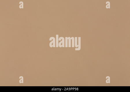 Texture of beige leather on macro. Can be used as background in art or design projects. Stock Photo