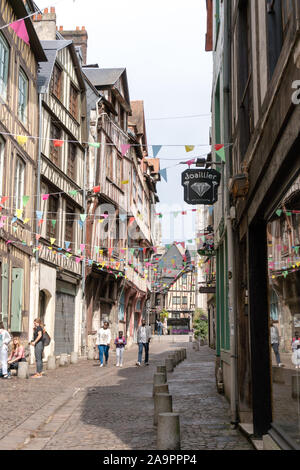 Rouen, Seine-Maritime / France - 12 August 2019: tourists visit the historic old city center of Rouen in Normandy with hits famous half-timbered house Stock Photo