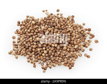 Heap of dried coriander seeds isolated on white background Stock Photo