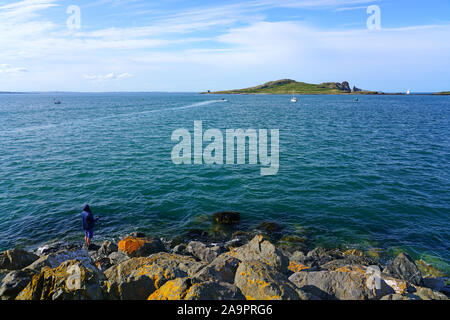 HOWTH, IRELAND -27 JUL 2019- View of the Ireland’s Eye, a small uninhabited island off the coast of County Dublin, Ireland, situated directly north of Stock Photo