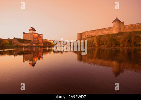 October twilight on the border Narva river. The border of Estonia and Russia Stock Photo