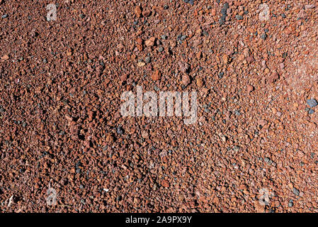 directly above shot of red volcanic soil background Stock Photo
