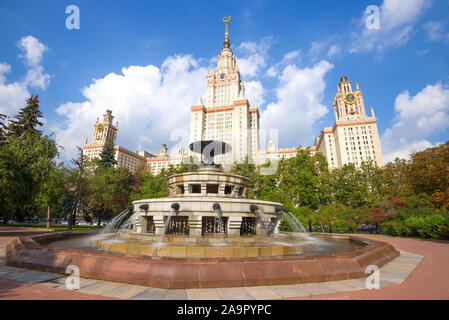 MOSCOW, RUSSIA - AUGUST 31, 2019: Fountain in the background of the main building of Moscow State University on a sunny August day Stock Photo