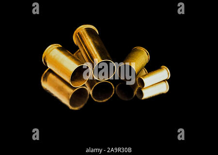 Comparison of sizes of different used bullet shells on a white isolated ...