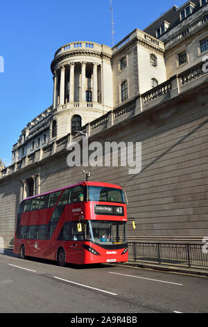 Red double decker bus passes the Bank of England, Princes Street, near Bank interchange, City of London, United Kingdom Stock Photo