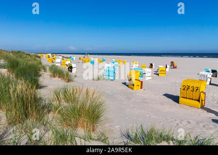 Beach and colourful beach chairs on a summer day on Juist, East Frisian Islands, Germany. Stock Photo