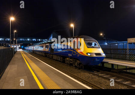 East MIdlands railway High Speed Train (intercity 125) calling at East Midlands Parkway railway station on the midland mainline at night Stock Photo