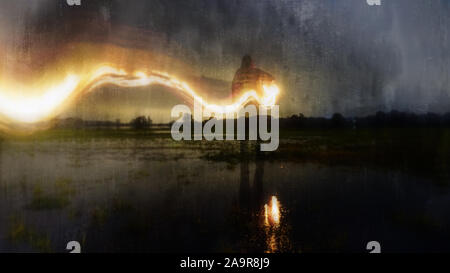 A delibrately blurred, abstract, out of focus, textured edit. Of a ghostly, eerie figure, standing in a flooded field, holding a glowing lamp with a f Stock Photo