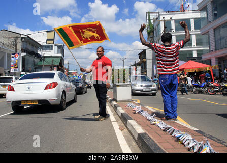 Colombo, Sri Lanka. 17th Nov, 2019. A supporter of Gotabaya Rajapaksa cheers along the street in Colombo, Sri Lanka, Nov. 17, 2019. Sri Lanka's Elections Chief Mahinda Deshapriya on Sunday afternoon confirmed that opposition candidate Gotabaya Rajapaksa won the presidential elections. Credit: Ajith Perera/Xinhua/Alamy Live News Stock Photo