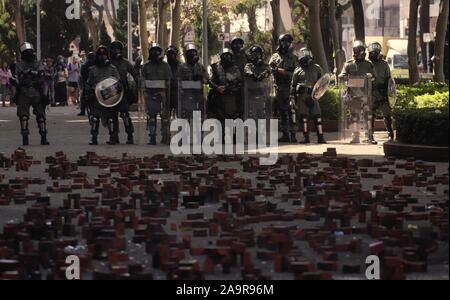 November 17, 2019, Hong Kong, CHINA: Riot Police stand guard on the pavement with bricks are placed as obstacles in order to stop police' advancement outside Hong Kong Polytechnic University.Nov-17,2019 Hong Kong.ZUMA/Liau Chung-ren (Credit Image: © Liau Chung-ren/ZUMA Wire) Stock Photo