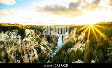 Sunset over the Upper Falls in the Grand Canyon of the Yellowstone River in Yellowstone National Park in Wyoming, United States of America Stock Photo