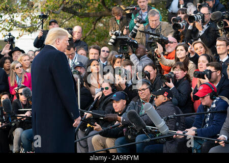 President Donald J. Trump talks to members of the press on the South Lawn of the White House Monday, Nov. 4, 2019, prior to boarding Marine One to begin his trip to Kentucky. Stock Photo