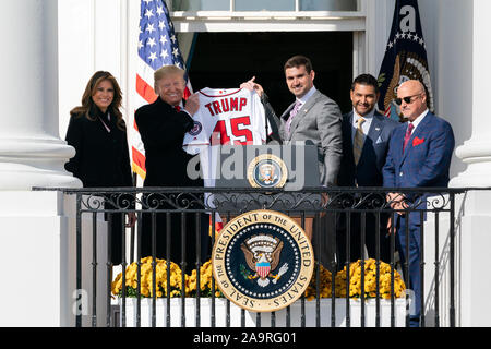 Nationals first baseman Ryan Zimmerman, joined by First Lady Melania Trump, Nationals Manager Dave Martinez and Nationals General Manager Mike Rizzo, presents President Donald J. Trump with a Nationals jersey on the Blue Room Balcony of the White House Monday, Nov. 4, 2019, during the celebration of the 2019 World Series Champions, the Washington Nationals on the South Lawn. Stock Photo