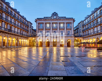 The Constitution square at nightfall (Plaza de la Constitucion). The central building in the background was, until 1947, the Town Hall of Donostia. Stock Photo