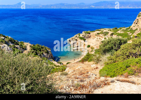 A beautiful view from a steep rocky slope on the Corinthian Gulf and the blue lagoon on the coast, a beautiful view from above. Stock Photo