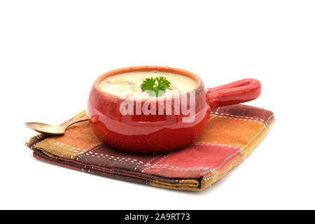 Homemade mushroom soup in an orange ceramic bowl on a white background. Stock Photo