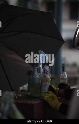 Hong Kong, China. 17th Nov 2019. A stash of molotov cocktails, or petrol bombs, can be seen behind the frontlines of the protests at Polytechnic University in Hong Kong. Protestors have occupied the premises for the past week, preparing for anticipated police confrontation by stockpiling materials, creating molotov cocktails, and building barricades. The university is currently on lockdown, with many protestors arrested. Credit: Katherine Cheng/Alamy Images. Stock Photo