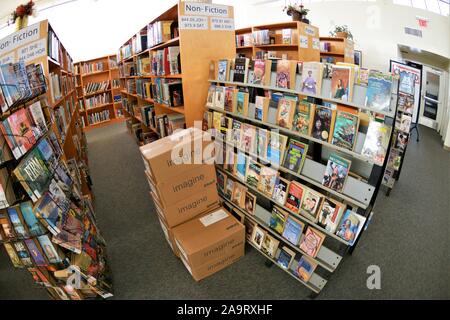 new books arriving in boxes at California high school in ready for start of school year for students for math, lit, society, art, social studies Stock Photo