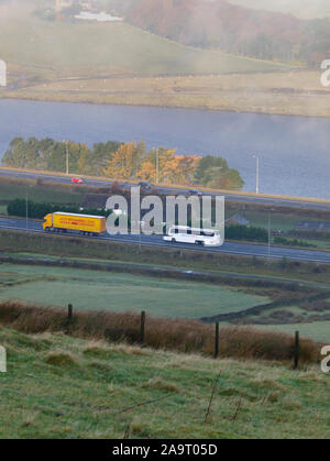 Stott Hall Farm and M62 in the mist fog from B6114 Saddleworth Road near Moselden Height Scammonden Stock Photo