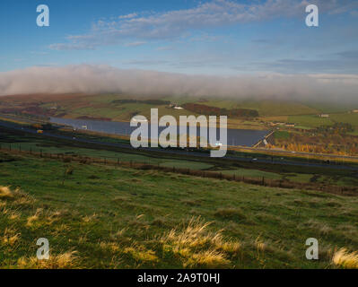 Stott Hall Farm, Booth Wood Reservoir & M62 in the mist fog from B6114 Saddleworth Road nr Moselden Height Scammonden Stock Photo