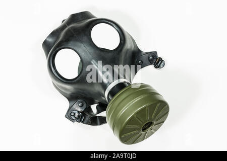 Old army surplus gas mask with white background. Stock Photo
