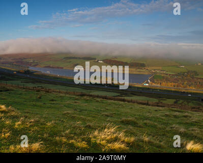 Stott Hall Farm, Booth Wood Reservoir & M62 in the mist fog from B6114 Saddleworth Road nr Moselden Height Scammonden Stock Photo