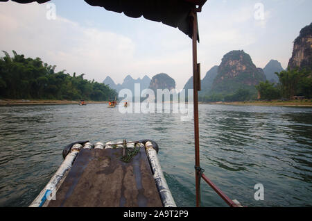 On a bamboo boat traveling along the Li River, Yangshuo, Guilin, China Stock Photo