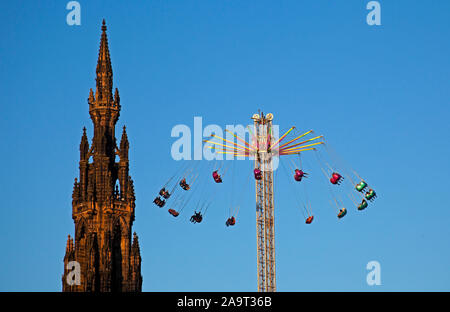 Edinburgh, Scotland, United Kingdom. 17th November 2019. A busy first full day in Princes Street Gardens Christmas Market and the star flyer at the funfair when the sun shone all day. Stock Photo