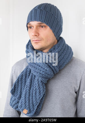 Cool man in winter fashion. Wearing scarf and knit hat Stock Photo