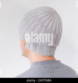 Cool man in winter fashion. Wearing scarf and knit hat Stock Photo