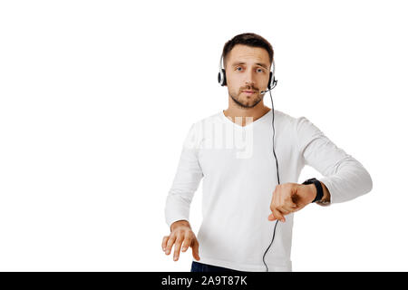 Call center worker man isolated on white background. Young cute employee telesales agent using headset. Stock Photo