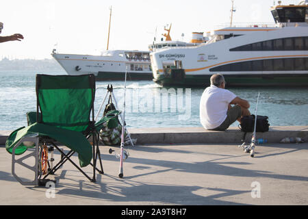 ISTANBUL, TURKEY - SEPTEMBER-14.2019: People resting on the seashore of Kadikoy coast. Stock Photo