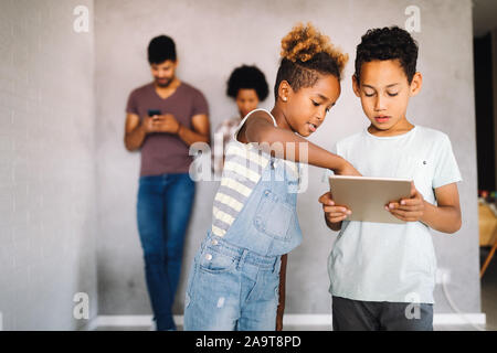Family sharing there privacy data by using digital devices, phones, tablets Stock Photo