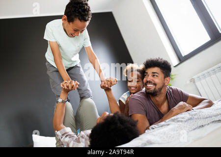 Happy black family having fun times at home Stock Photo