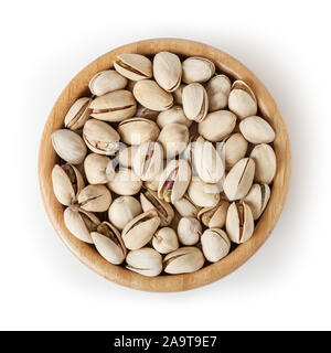 Salted pistachios in wooden bowl isolated on white background with clipping path Stock Photo