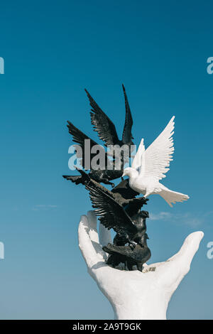 Kusadasi, Aydin Province, Turkey - September 9, 2019: Hand Of Peace Monument On Waterfront In Sunny Summer Day. View Of Hand Sculpture At Aegean Coast Stock Photo