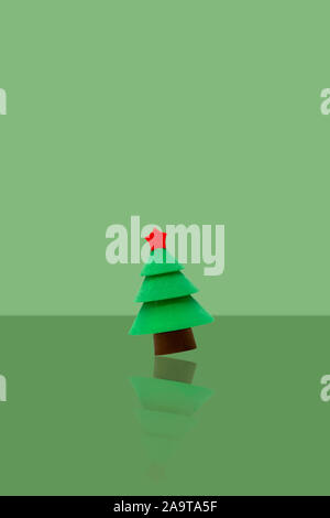 Pine tree fly with green background.Merry christmas and Happy New Year card. Stock Photo