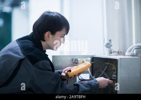 Engineer woman working indoor ckecking Stock Photo