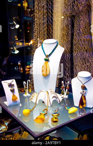 Display of amber pendant necklaces at a shop in Krakow, Poland Stock Photo