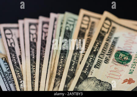 Money on the table, dollars on black table. Business concept Stock Photo